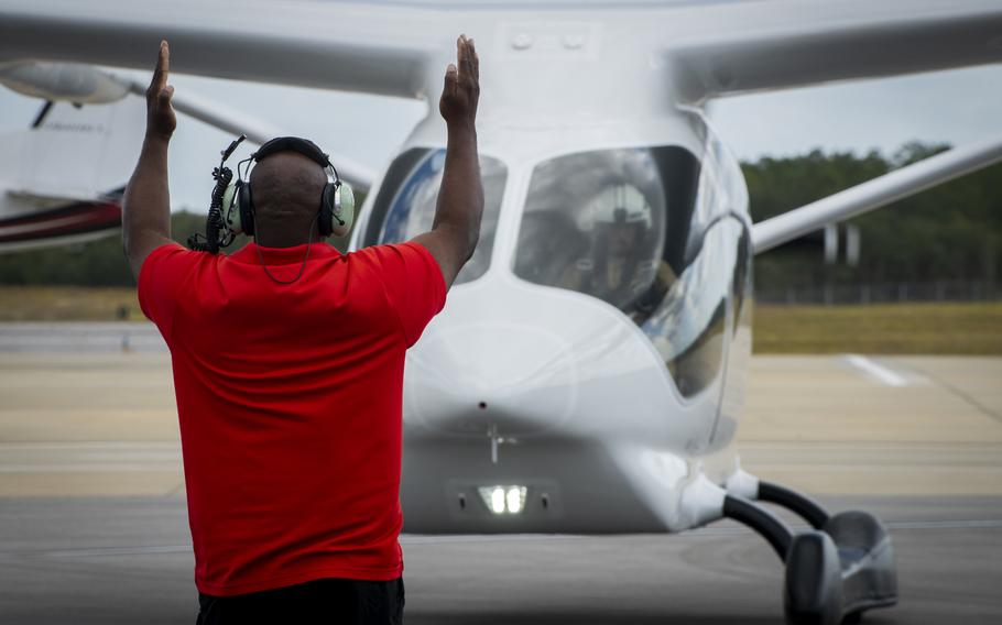 Ron Sheridan of the 96th Aircraft Maintenance Squadron, directs an Alia electric airplane to a stop at Eglin Air Force Base, Fla., Oct. 26, 2023. The plane will begin a series of test flights over the next few months.