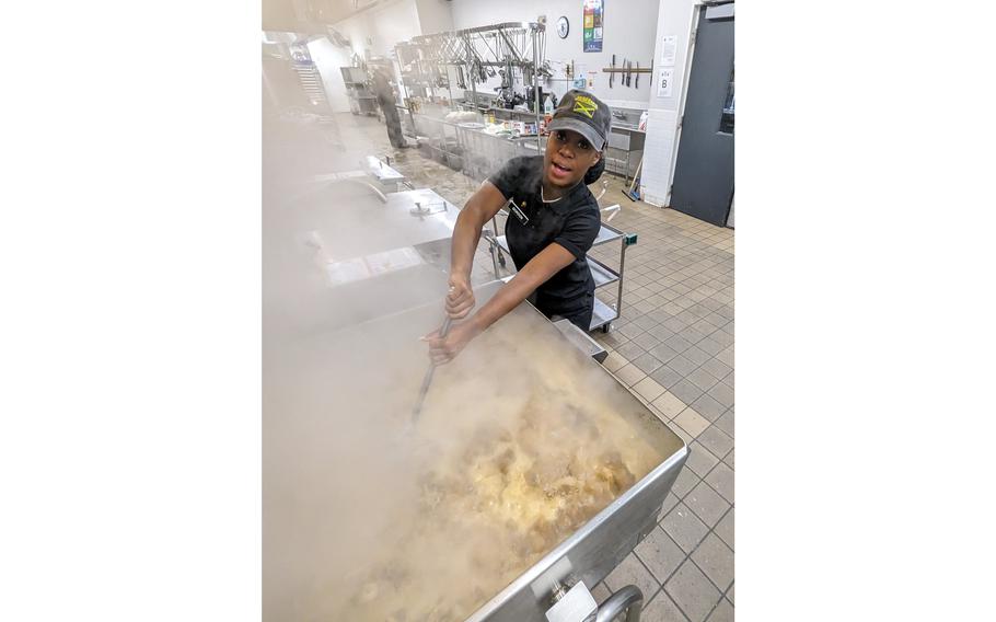 A culinary specialist in the 10th Mountain Division at Fort Drum, N.Y., helps prepare a Thanksgiving meal for soldiers and family members, Tuesday, Nov. 21, 2023.