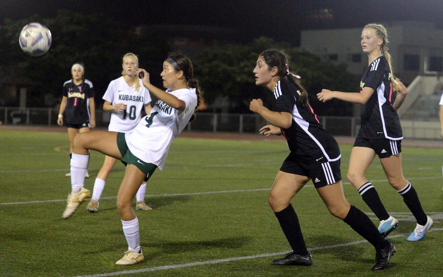 Kubasaki's Sakura Lopez tries to play the ball in front of Kadena's Sophia Fineman and Brooke Brewer during Wednesday's DODEA-Okinawa girls soccer match. The teams played to a 1-1 draw.