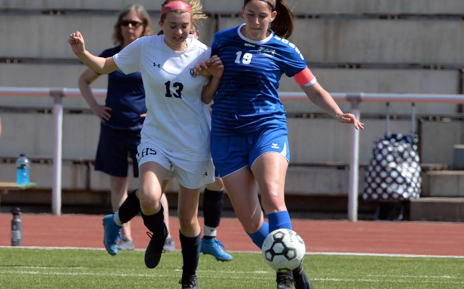 Lakenheath’s Heidi Amberson, left, and Ramstein’s Emma Shockley fight for the ball in a Division I girls semifinal at the DODEA-Europe soccer championships in Kaiserslautern, Germany, May 18, 2022. Ramstein won 1-0 to advance to Thursday’s final against Stuttgart.