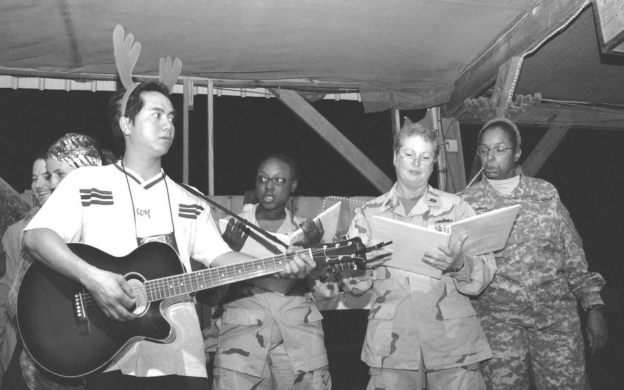 Christmas carolers brighten spirits at Djibouti’s Camp Lemonier on Dec. 22, 2006. Some 1,500 airmen, soldiers, sailors and Marines would spend the holidays in the Horn of Africa that year.