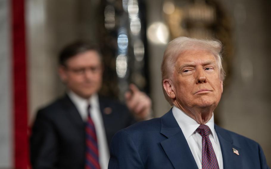 A man looks at something out of frame.