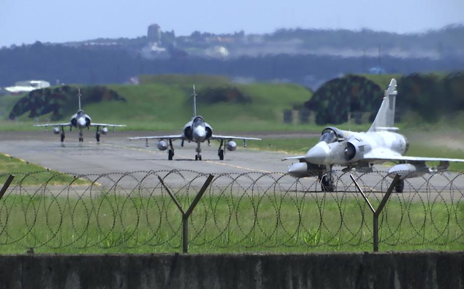 Taiwan Air Force Mirage fighter jets taxi on a runway at an airbase in Hsinchu, Taiwan, Friday, Aug. 5, 2022. China says it summoned European diplomats in the country to protest statements issued by the Group of Seven nations and the European Union criticizing threatening Chinese military exercises surrounding Taiwan.