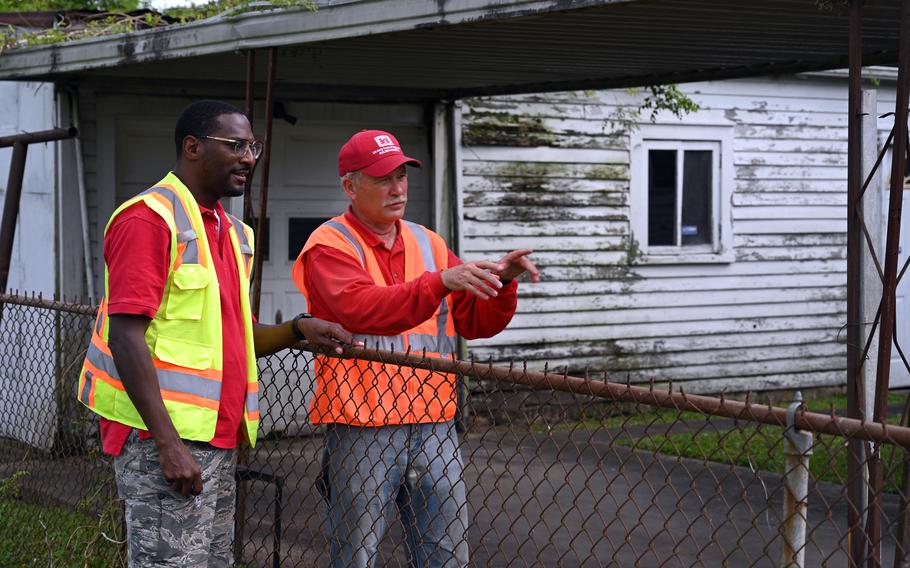 Richard Fisher, left, U.S. Army Corps of Engineers, Vicksburg District safety and occupational health specialist, and Rick Hart, Hurricane Ida quality assurance specialist, monitor temporary roof repairs in New Orleans, Oct. 20, 2021. A major bill set for passage by Congress is expected to eventually result in billions of dollars in flood risk reduction projects in Louisiana as well as trigger a review of whether New Orleans area levees should be further strengthened to protect against so-called 200-year storms.