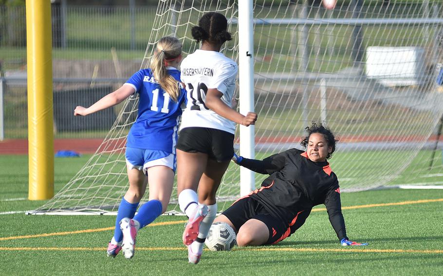 Kaiserslautern goalkeeper Jada Hollis beats Ramstein defensive midfielder Audrey Singer to a ball during a match on April 12, 2024, at Ramstein High School on Ramstein Air Base, Germany.