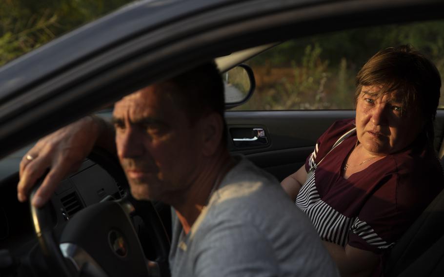 Svitlana, 53, who worked at the Zaporizhzhia nuclear power plant, with husband Oleksandr, 56, wait in a convoy arriving in Ukrainian-held territory on Aug. 12, 2022.