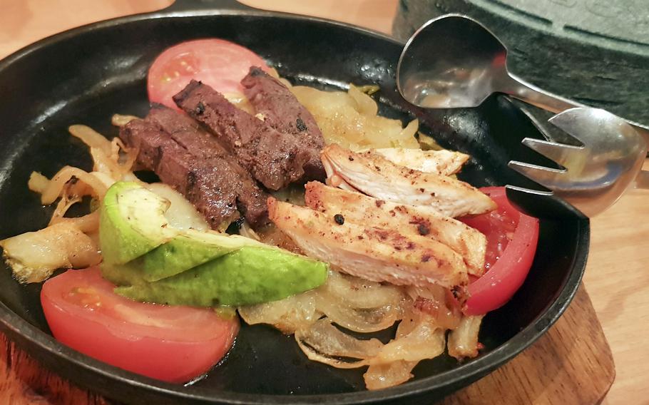 A combination plate of colorful food.