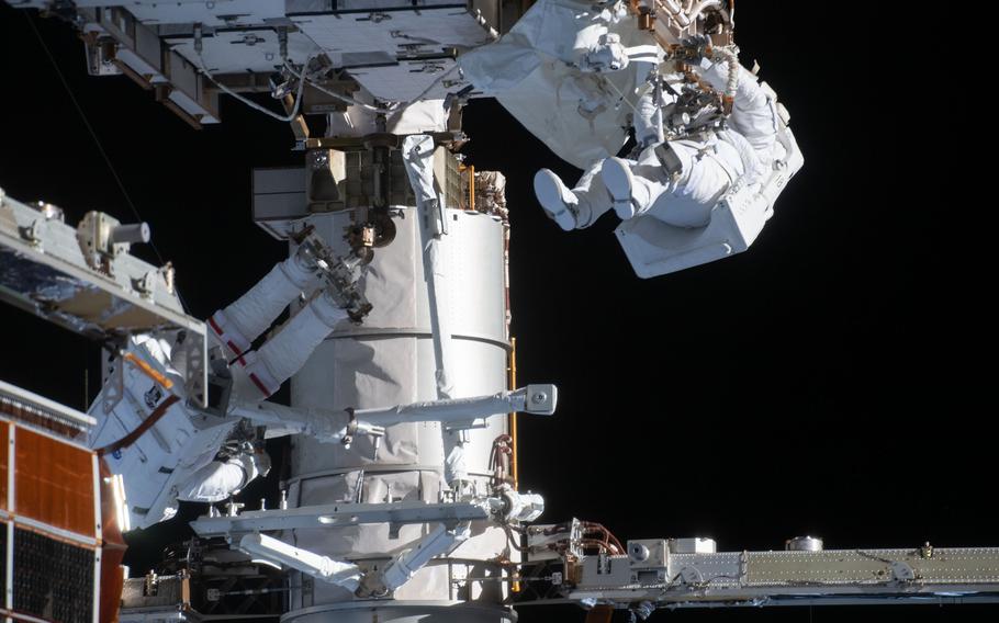 NASA astronauts Kate Rubins, bottom left, and Victor Glover, top right, during a spacewalk to install solar array modification kits on the International Space Station on February 28, 2020. NASA, which plans to operate the station through 2030, has continued to use Russian Soyuz spacecraft to transport astronauts to and from the ISS since retiring shuttles in 2011.