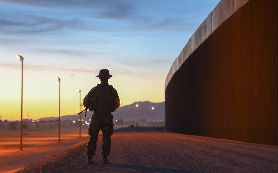 A Texas National Guard member assigned to Operation Lone Star patrols the Texas-Mexico border on May 9, 2023, in El Paso, Texas.