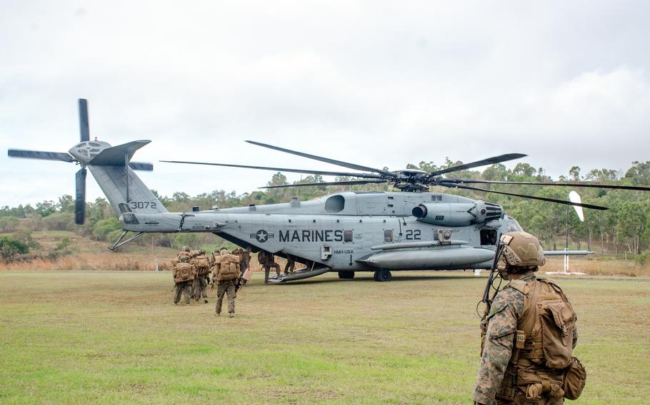 U.S. Marines board a CH-53 Super Stallion during an uncontested air-assault exercise at Bloomsbury Airfield in Midge Point, Australia, Friday, June 28, 2023.