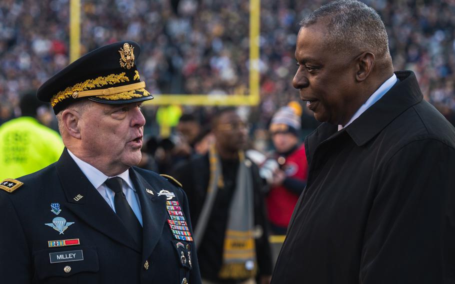 Secretary of Defense Lloyd J. Austin III speaks to Chairman of the Joint Chiefs of Staff U.S. Army Gen. Mark A. Milley during the annual Army-Navy football game, in Philadelphia, Pa., on Dec. 10, 2022.