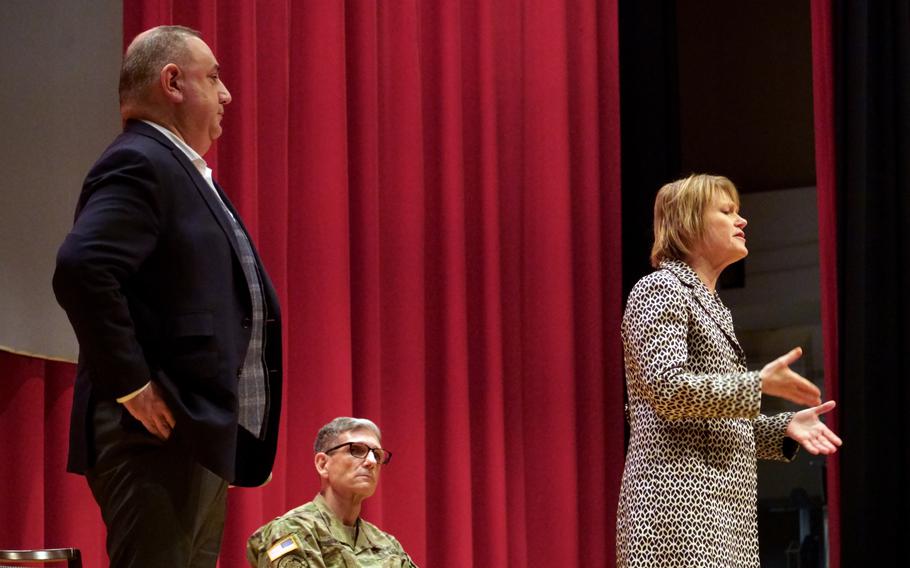 Gilbert Cisneros Jr., left, undersecretary of defense for personnel and readiness; Seileen Mullen, right, acting assistant secretary of defense for health affairs; and Army Maj. Gen. Joseph Heck answer questions about civilians' access to medical care during a town hall at Yokosuka Naval Base, Japan, Tuesday, Jan. 31, 2023. 