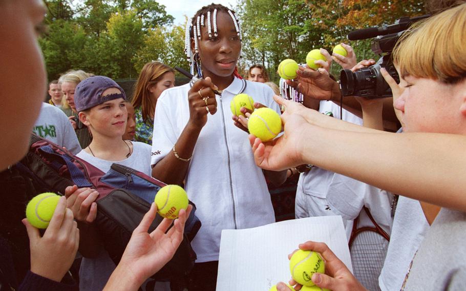 Teenage tennis star Venus Williams signs autographs for students 
