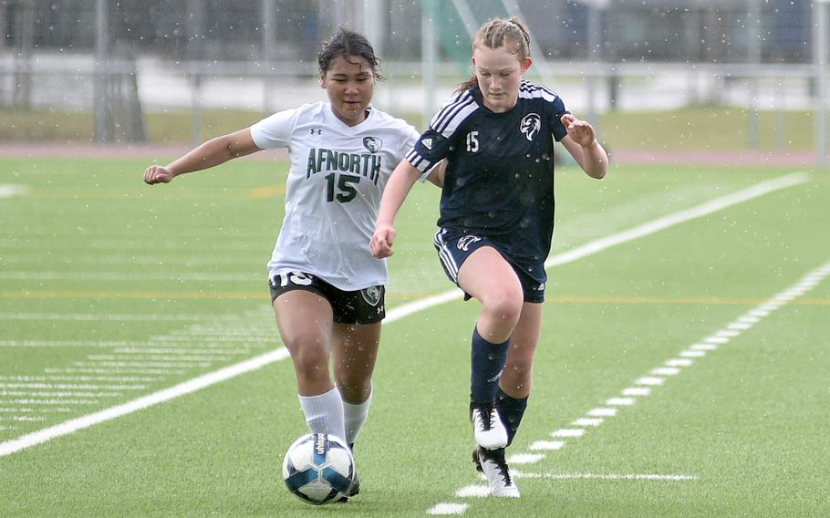 AFNORTH defender Koren Russel and Black Forest Academy’s Anna Yancey tussle over the ball during a match on April 20, 2024, at Ramstein High School on Ramstein Air Base, Germany.