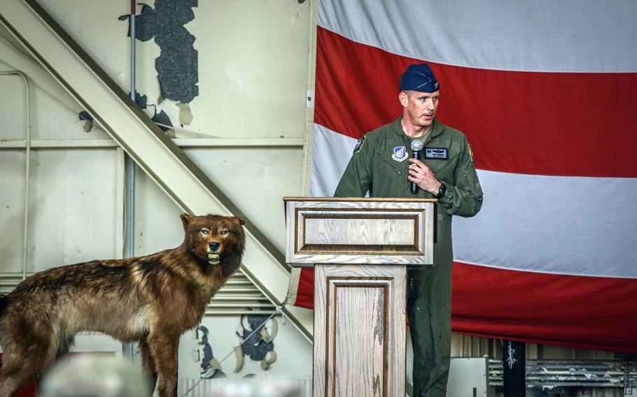 Col. Peter Kasarskis gives his inaugural speech as 8th Fighter Wing commander alongside the wing’s wolf mascot during a change-of-command ceremony at Kunsan Air Base, South Korea, June 7, 2024. 