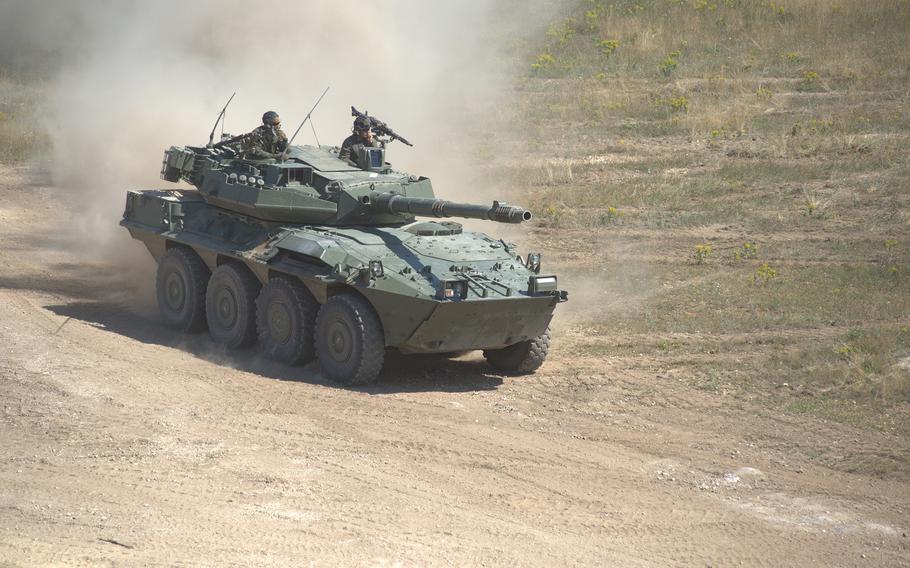 A Spanish Centauro cavalry and reconnaissance vehicle traverses a firing and training range.