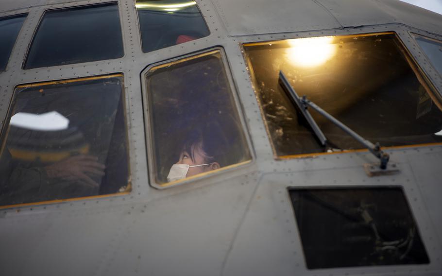 A Japanese elementary school student tours a KC-130J Super Hercules during a visit to Marine Corps Air Station Iwakuni, Japan, Thursday, Sept. 23, 2021.