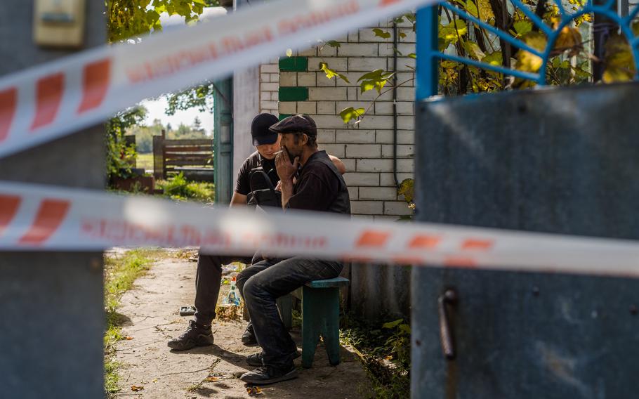 Andrei Dmitriev, 48, who said he was a victim of a Russian torture, gives a statement to police, in Pisky Radkivsky, Ukraine, on Oct. 6. 