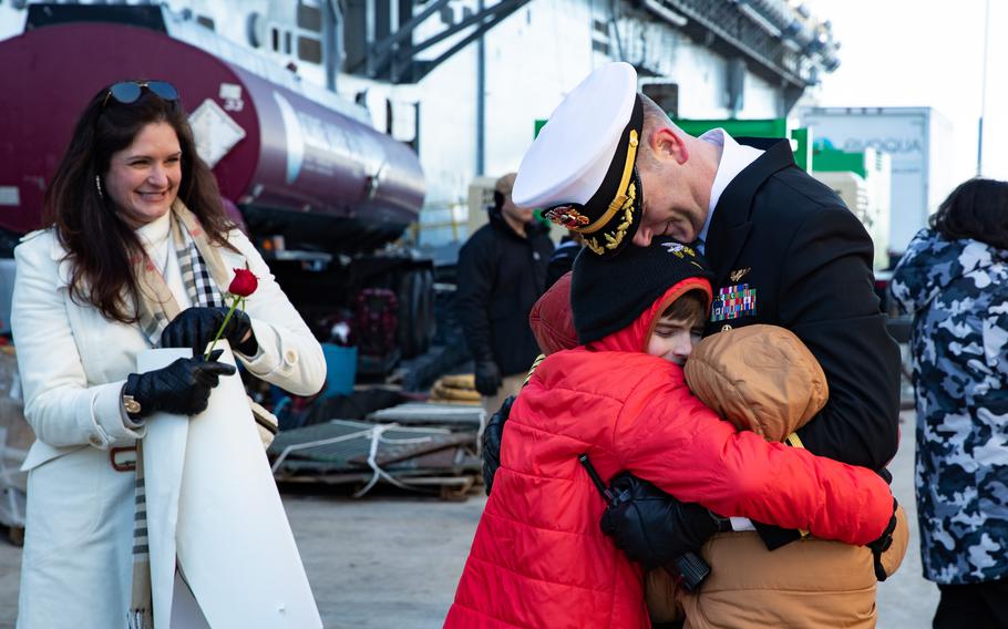 The USS Gerald R. Ford’s executive officer Matthew Mulcahey receives a welcome home from his family upon returning from the ship’s eight-month maiden deployment, Wednesday, Jan. 17, 2024.