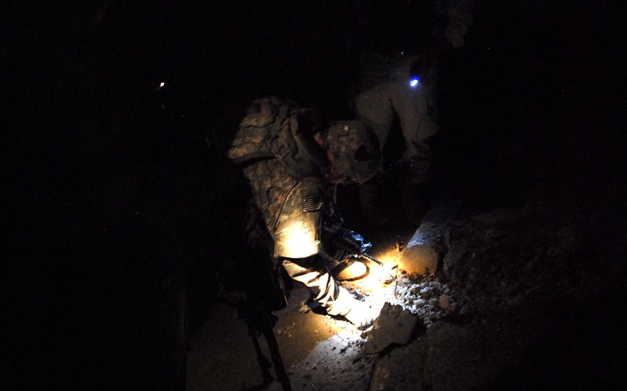 2nd Lt. Jedidiah Wentz of Troop A, 1st Battalion, 75th Cavalry Regiments, checks the site of a small roadside bomb that targeted an Iraqi patrol in the Gazaliyah district of western Baghdad, causing minor damage to a humvee but no casualties. Bomb attacks continue to average about three per week, but most are small and rarely target U.S. patrols, officers say.