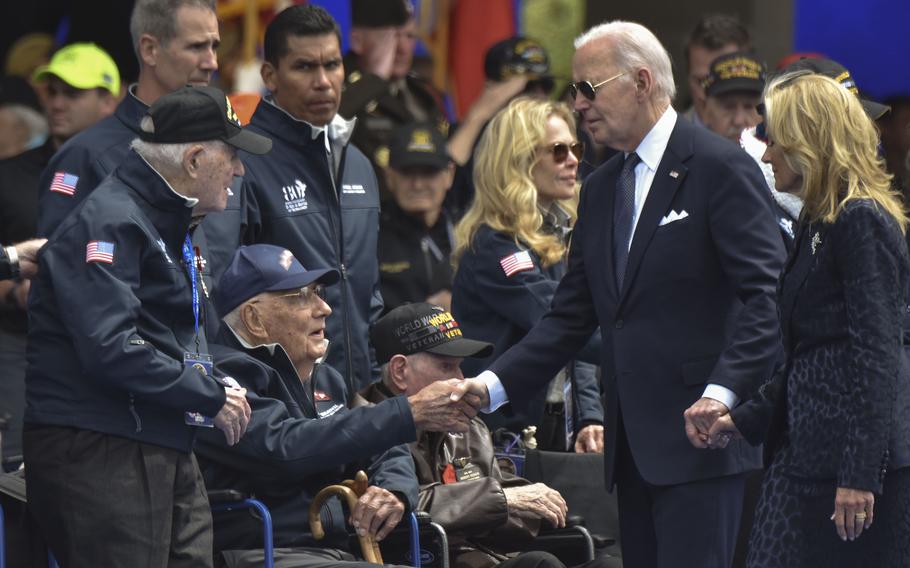 President Joe Biden shakes hands with World War II veteran John Wardell during the D-Day 80th anniversary commemoration at Normandy American Cemetery in Colleville-sur-Mer, France, on June 6, 2024. Wardell received the Legion of Honor award from French President Emmanuel Macron.