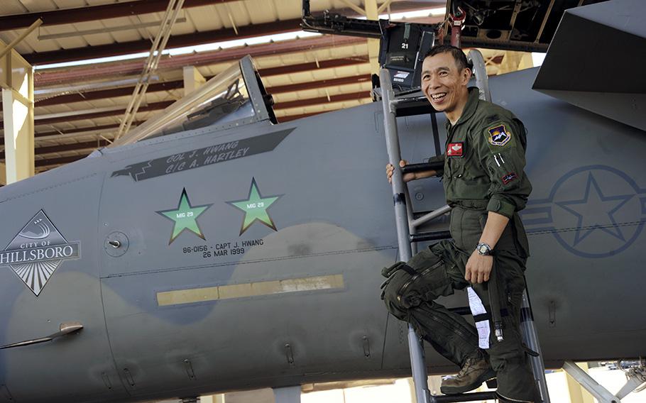 Col. Jeff Hwang, stands beside the F-15 Eagle he flew for his Fini flight, on Sept. 19, 2014, at the Portland Air National Guard Base in Oregon. The two green stars were added to his aircraft to acknowledge the two MIG 29s he shot down in Kosovo in 1999. The aircraft was flown to Ohio on Tuesday, April 25, 2023, where it will become a museum piece at the National Museum of the U.S. Air Force.