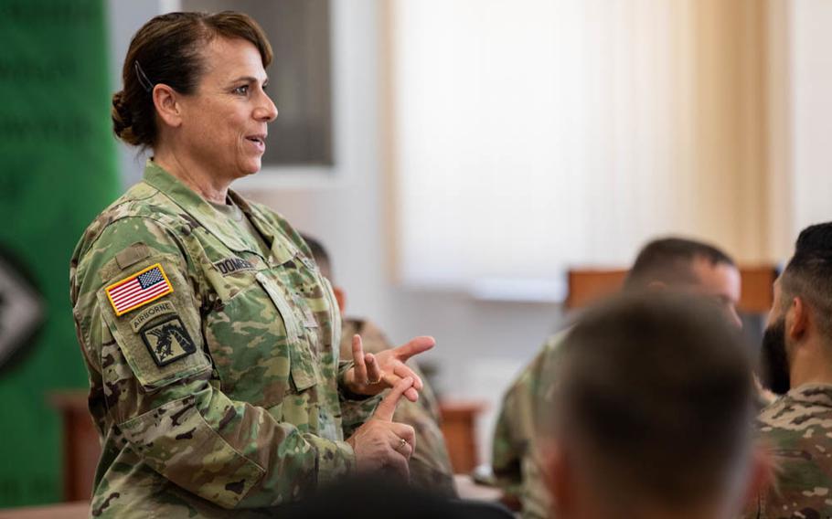 Command Chief Warrant Officer 5 Teresa Domeier speaks with soldiers about being a warrant officer during a visit to Bemowo Piskie Training Area, Poland, June 30, 2019.