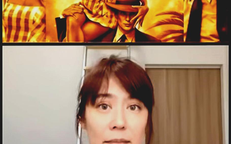 Sachiko Ishikawa, a YouTube video blogger from Tokyo, talks about the "Barbenheimer" controversy in Japan against a backdrop of the fan poster on  Aug. 9, 2023. 