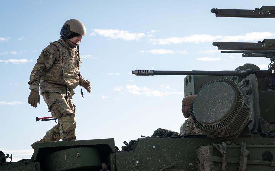 Pfc. Kaleb Odachowski, left, and Sgt. Orlando Sutherland participate in an M-SHORAD exercise at Lest Training Area, Slovakia, Dec. 20, 2023. 