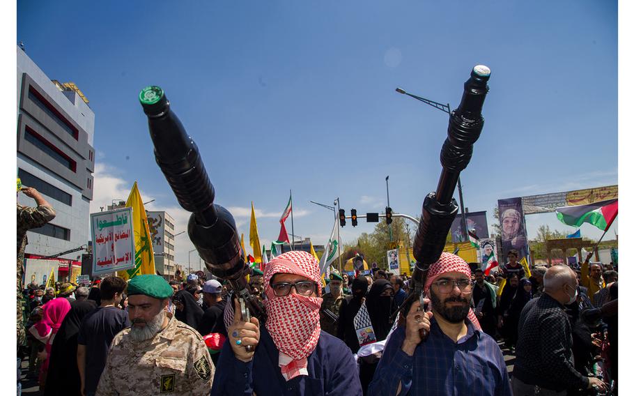 Iranians in Tehran on April 5, 2024, attend the annual Quds (Jerusalem) Day commemorations and the funeral of seven Revolutionary Guard Corps members killed in a strike on the country’s consular annex in Damascus.