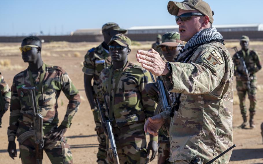 U.S. Air Force Tech. Sgt. Daniel Iannarelli explains the next phase of a field training exercise to Nigerien troops at Air Base 201 in Niger in 2022. U.S. defense officials on Tuesday downplayed the idea that American military training is responsible for a series of coups in Africa, including one in Niger in July.