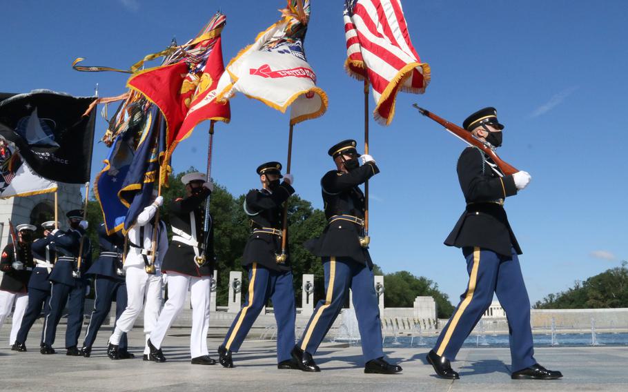 The color guard arrives for a Memorial Day ceremony at the National World War II Memorial in Washington, D.C., May 31, 2021.