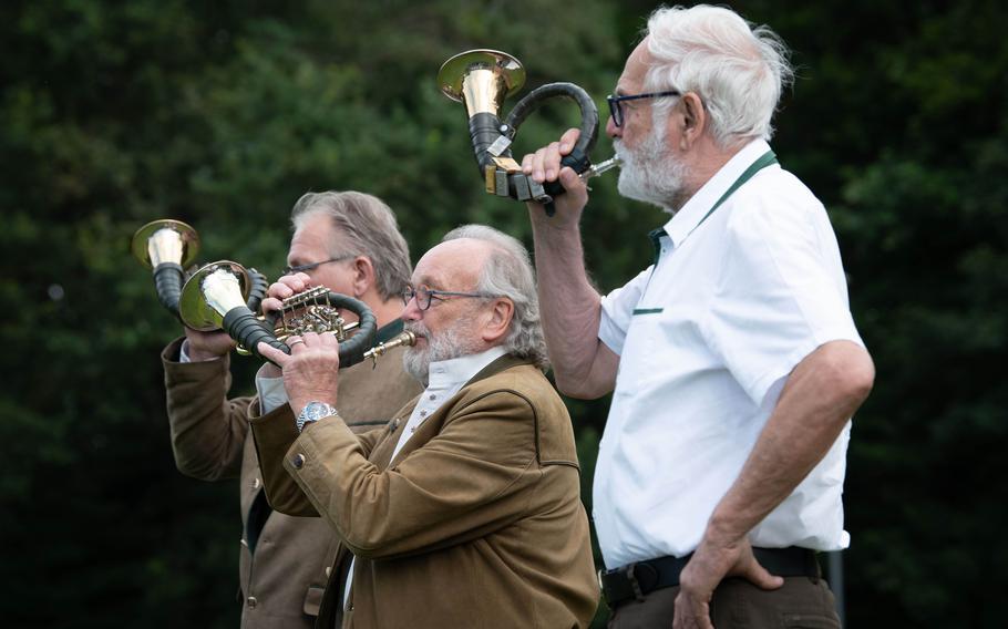 A German horn trio, which traditionally plays during hunting expeditions, plays at a ceremony in Kaiserslautern, Germany, on July 11, 2024, during which Col. Reid Furman relinquished command of U.S. Army Garrison Rheinland-Pfalz. Furman invited the trio to play after taking up hunting as a hobby while living in Germany.