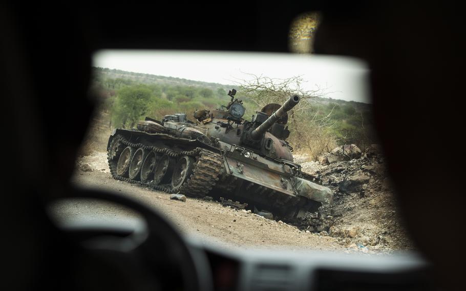 A destroyed tank lies on the side of the road in an area of western Tigray annexed by the Amhara region during the ongoing conflict, in Ethiopia, on May 1, 2021. The United Nations announced Thursday, Nov. 18, that six U.N. staff members detained by the Ethiopian government were released.