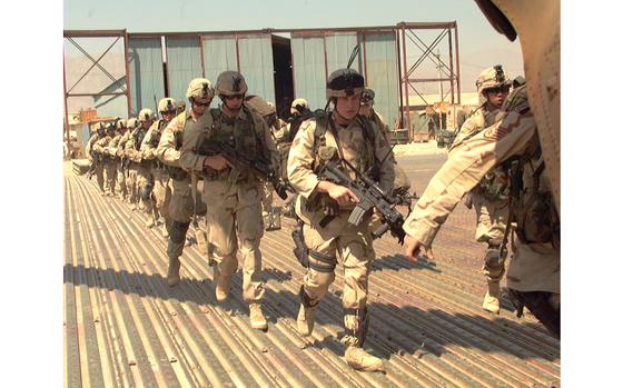 Bagram Air Base, Afghanistan, Sep. 10, 2003: Quick Reactionary Force soldiers load onto a Chinook at the Bagram Air Base flight line. The soldiers, from 10th Mountain Division’s Company A, 2nd Battalion, 87th Infantry Regiment, were put on alert and had to be ready to board the Chinook in 15 minutes. The alert turned out to be an exercise.


META TAGS: U.S. Army; Operation Enduring Freedom; combat