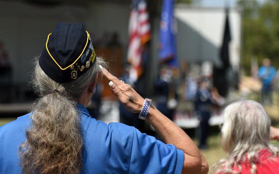 Cynthia Verrill, Linda American Legion Post 807 commander, salutes the flag during the playing of the National Anthem during the Yuba-Sutter Stand Down Aug. 24, 2018, in Marysville, California.The Stand Down gives local veterans and their families the opportunity to seek services, such as dental, veteran benifits and social security, in a sigle location. (U.S. Air Force photo by Staff Sgt. Ramon A. Adelan)