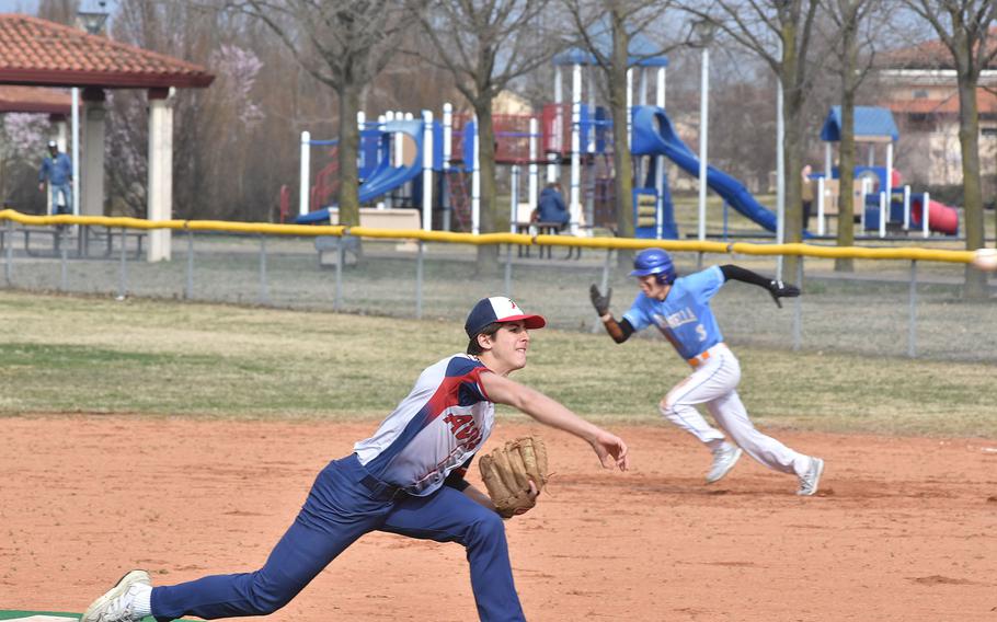 Sigonella’s CJ Davis sprints towards second while Aviano pitcher Colin North delivers to the plate as the two teams battled Saturday, March 18, 2023 in a doubleheader at Aviano Air Base, Italy. The Saints and Jaguars hope to at least reach the tournament finals this week against perennial power Naples.