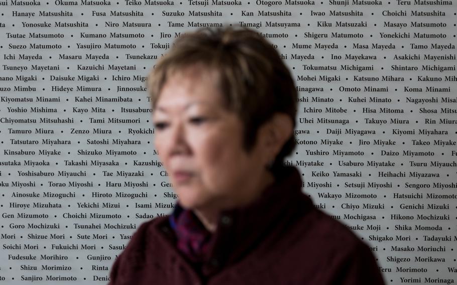 Janet Matsuoka Keegan, a Friends of Minidoka board member, stands in front of the Issei Memorial Wall at the Minidoka National Historic Site in Jerome, Idaho, on April 21, 2023. MUST CREDIT: Photo for The Washington Post by Jared Ragland