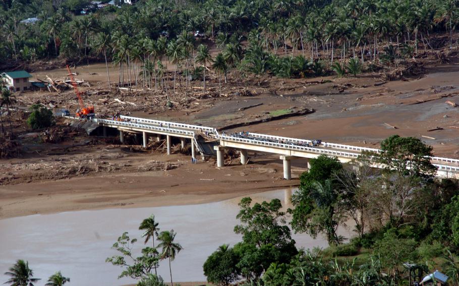 A bridge wiped out by mud slides near the town Real is hampering relief efforts in the storm-splintered area. To overcome access problems, U.S. military personnel ferried aid in by helicopter as part of their humanitarian mission.