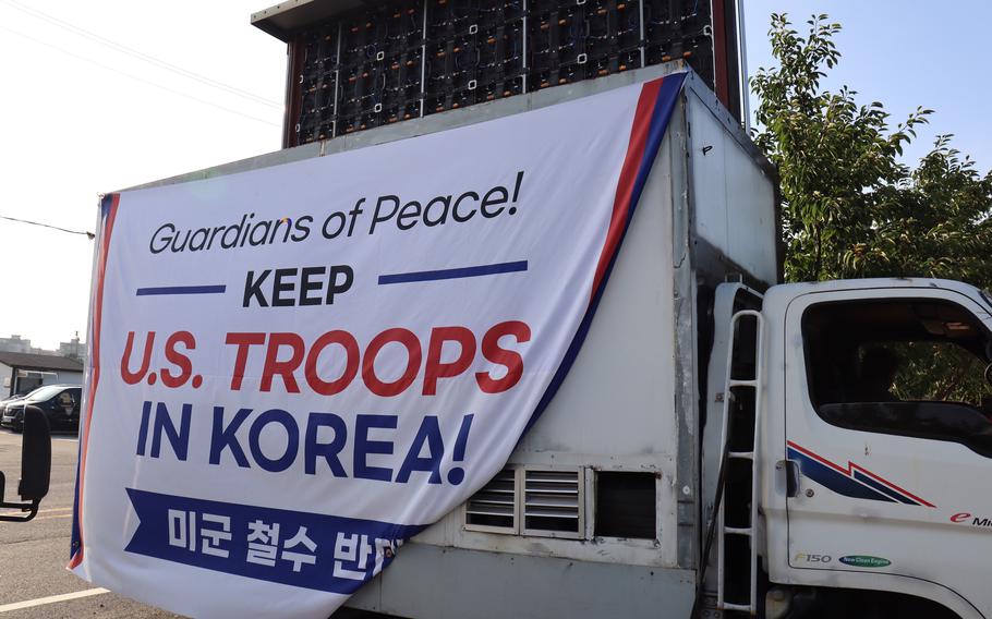 Speakers mounted on a truck play political speeches and music during a demonstration near Camp Humphreys, South Korea, Thurday, July 27, 2023