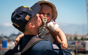 NORFOLK, Va. (June 9, 2025) – Logistics Specialist 1st Class Richard Feliciano, assigned to the Arleigh Burke-class guided-missile destroyer USS Gravely (DDG 107), embraces his son, June 9, following a three-month deployment to U.S. Northern Command’s area of responsibility. Gravely deployed under USNORTHCOM’s maritime homeland defense authorities with a U.S. Coast Guard Law Enforcement Detachment (LEDET) embarked to enable maritime interdiction missions to prevent the flow of illegal drugs, illegal migration and other illegal activity. USNORTHCOM is working together with the Department of Homeland Security to provide additional military forces and capabilities to secure the southern border. (U.S. Navy Photo by Mass Communication Specialist 2nd Class Derek Cole)