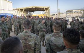 Air Force Gen. Dan Caine, chairman of the Joint Chiefs of Staff, talks to sailors at Naval Support Activity Souda Bay in Greece on Sunday.