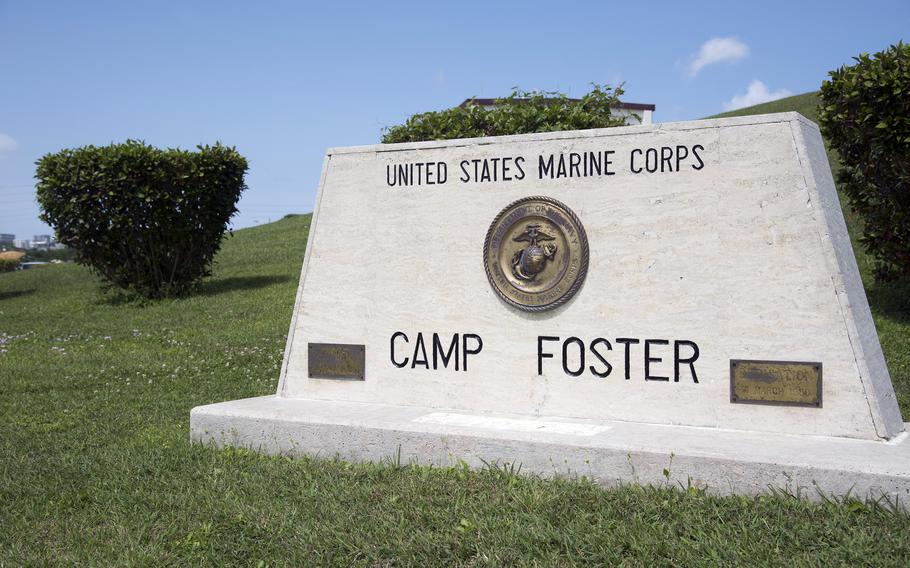 A white sign says United States Marine Corps Camp Foster.