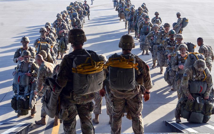 Paratroopers assigned to the 3rd Brigade Combat Team, 82nd Airborne Division get ready to board an Air Force C-17 aircraft during an exercise at Fort Bragg, N.C., in 2019. The Pentagon said Jan. 24, 2022, that roughly 8,500 troops based in the U.S. are ready to mobilize on short notice, should NATO activate its quick reaction force. 