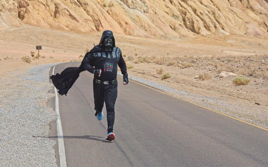 Jon Rice runs a mile while dressed as Darth Vader in Death Valley in 2022. Now 52, the New Mexico resident completed the near-annual challenge Sunday as temperatures neared 130 degrees Fahrenheit.