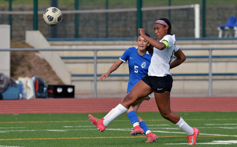 Ramstein’s Ava Smith boots the ball past Stuttgart’s Jedaiah Quindland and into the goal for the Royals last goal in their 3-1 win over the Panthers in the Division I title game at the DODEA-Europe soccer championships in Ramstein, Germany, May 22, 2025.
