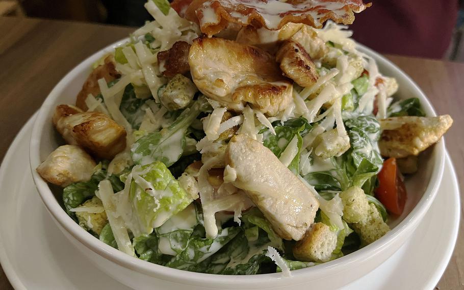 The Caesar salad at Mathilda in Wiesbaden, Germany, is served with turkey breast and a slice of crisp bacon. 