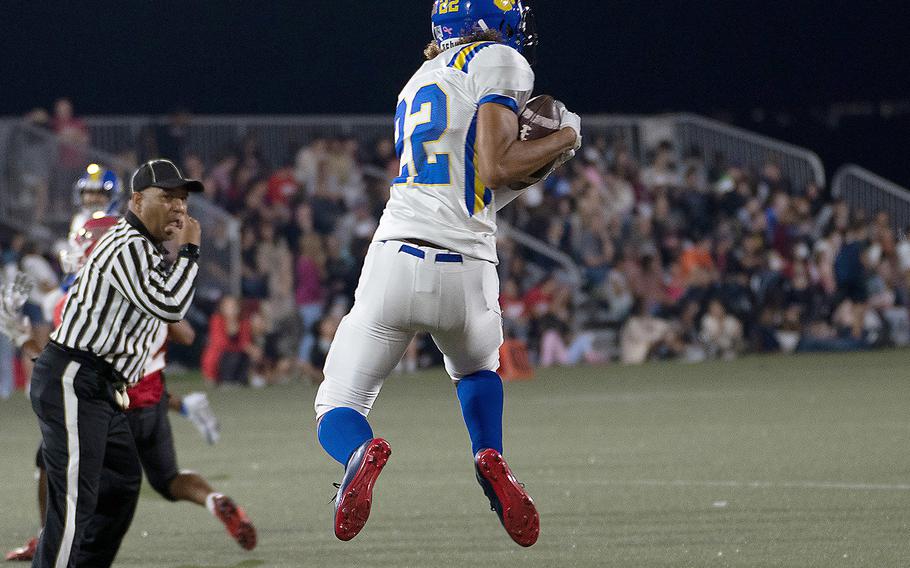 Yokota's Damian Abrams goes airborne to catch a pass.