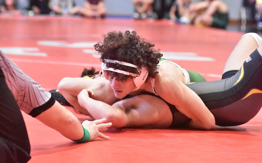 Naples senior Kyson Fromm gets three points for a near-fall on the way to a pin of Vicenza’s Peter Hartman at 157 pounds on Saturday, Jan. 27, 2024, in a meet at Aviano Air Base, Italy. Fromm is unbeaten and will be one of the favorites in his weight class at the DODEA-Europe championships in February.
