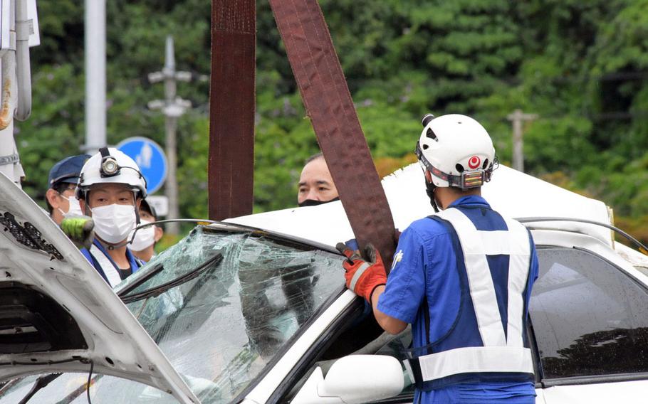 Okinawa police say a Marine was killed Saturday, May 14, 2022, after the car he was driving veered off Route 58 and crashed into a light pole and pedestrian fence outside Camp Foster, Okinawa.
